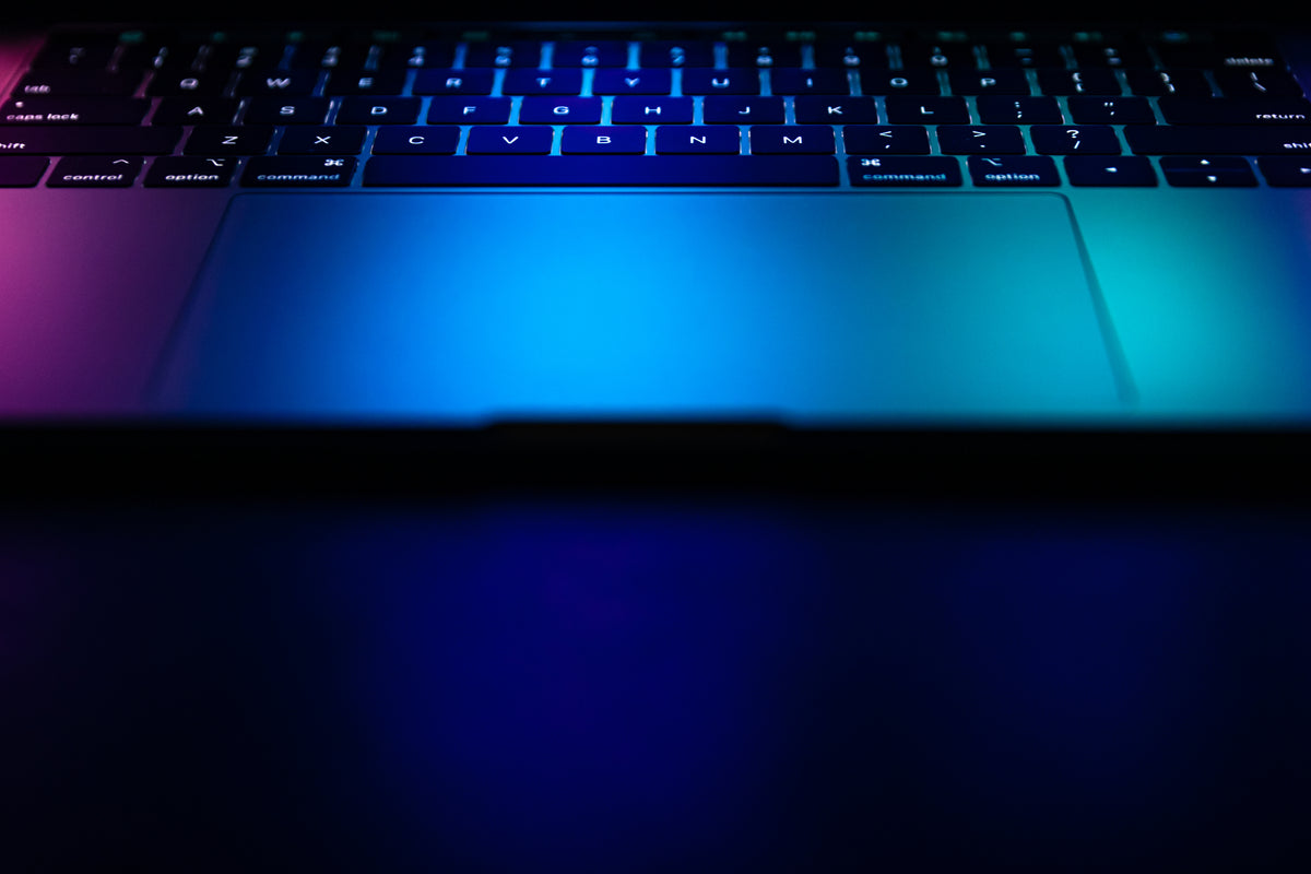 Laptop keyboard with glowing blue light